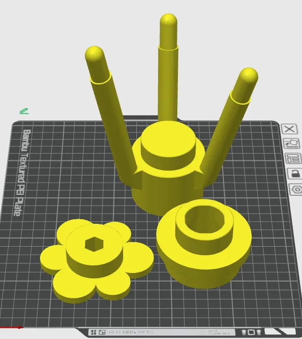 The same three parts spread across the build plate after arranging