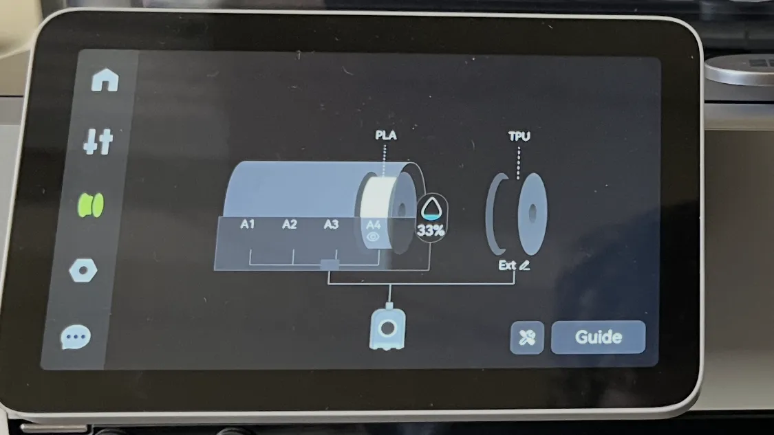 Printer touchscreen showing the AMS with a single white PLA spool loaded in slot A4 at 33 percent, and TPU on the external spool holder
