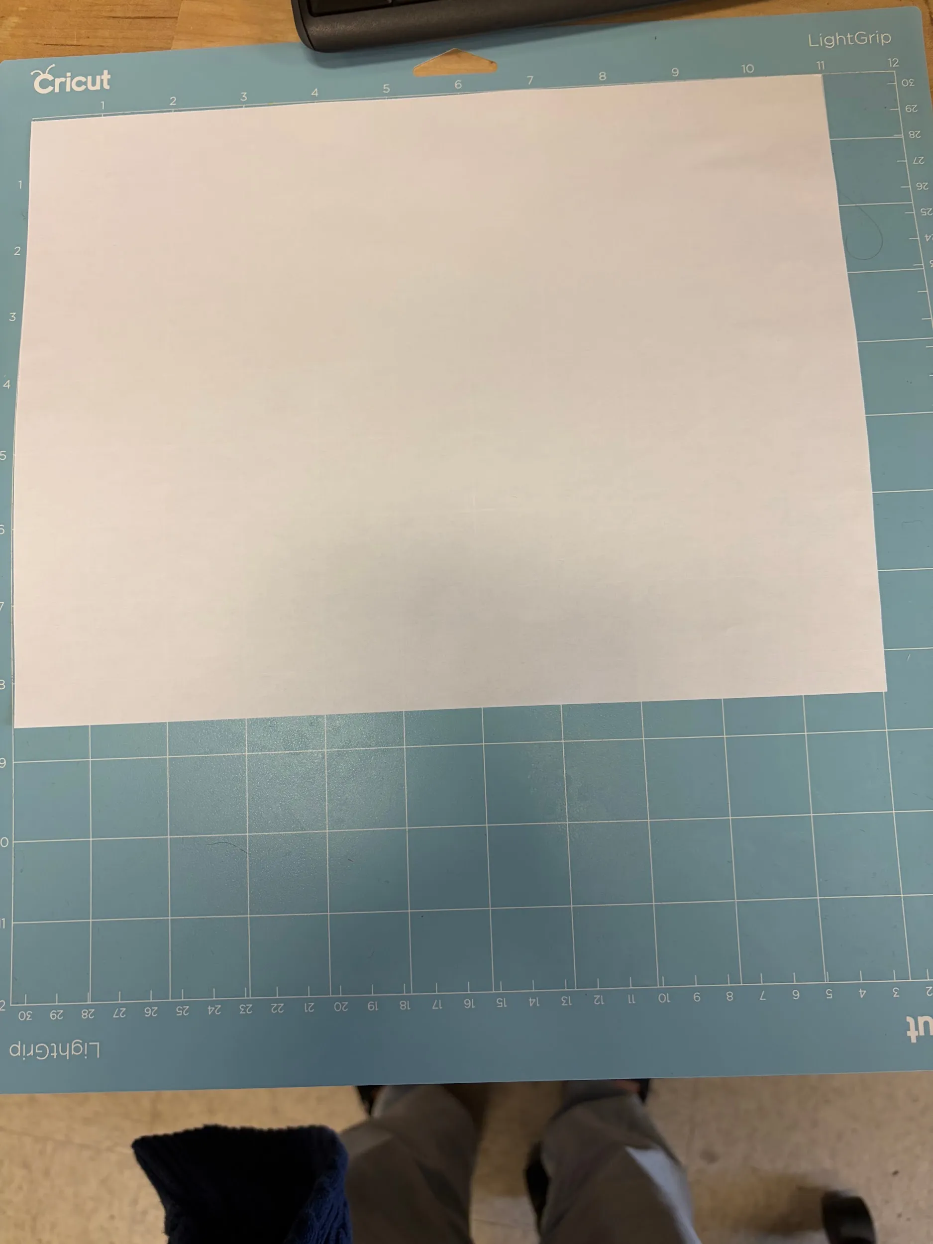 Cardstock attached to the cutting mat, ready to load