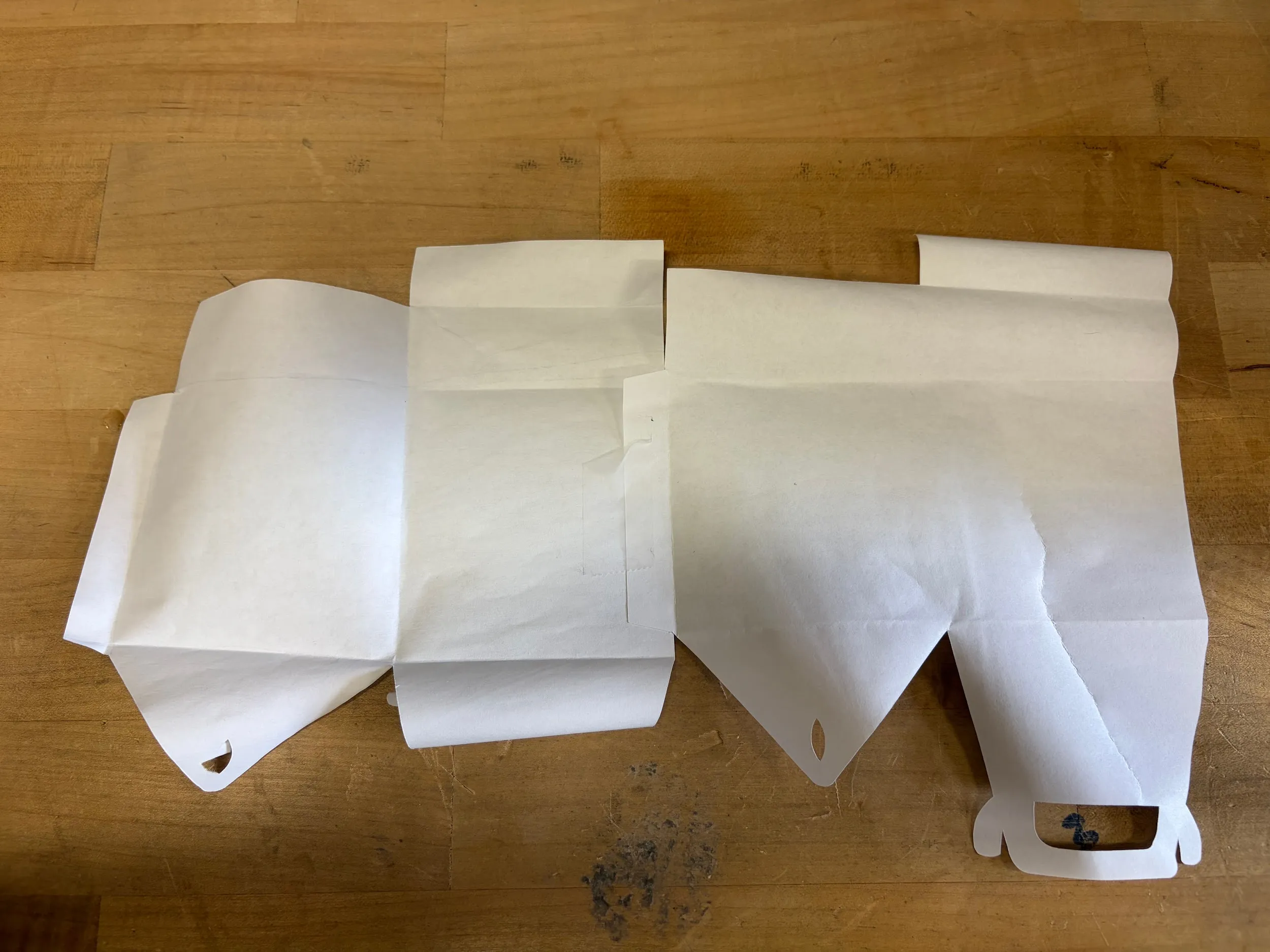 Taping the inner tab of the right piece to the body of the left piece
