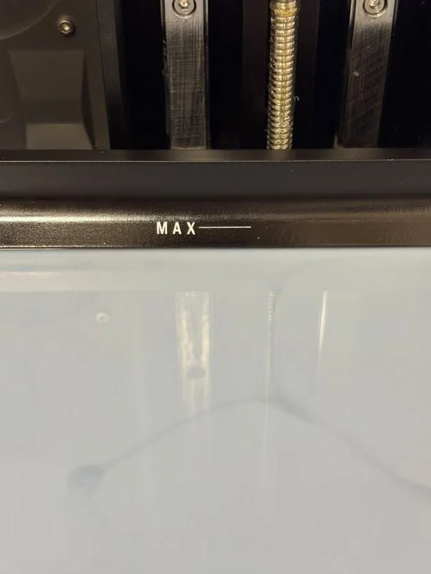 Close-up of the MAX line marked on the inside wall of the resin tank above the grey resin